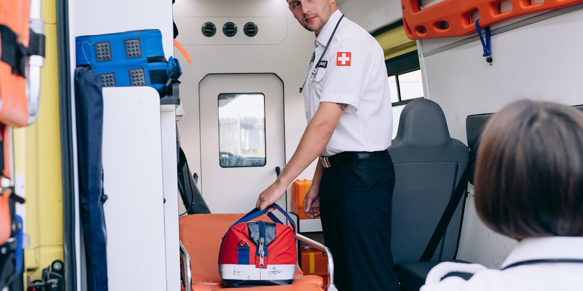 Paramedic with medical supplies — fentanyl opioid overdose emergency response schools
