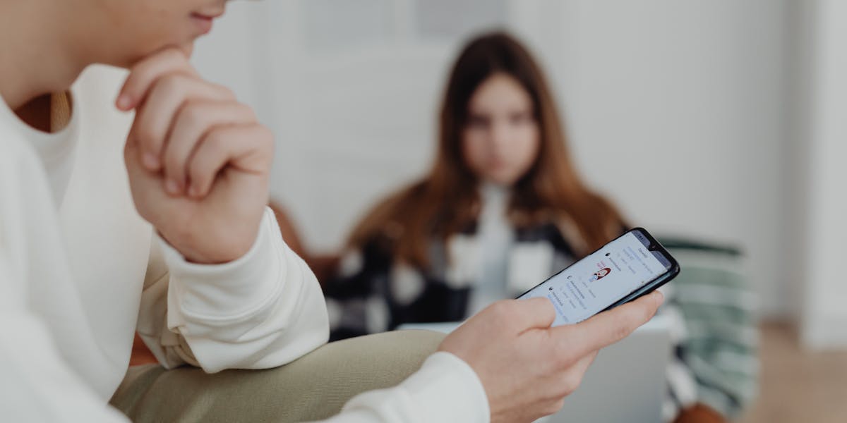 Teenager on smartphone — online exploitation warning signs parents miss